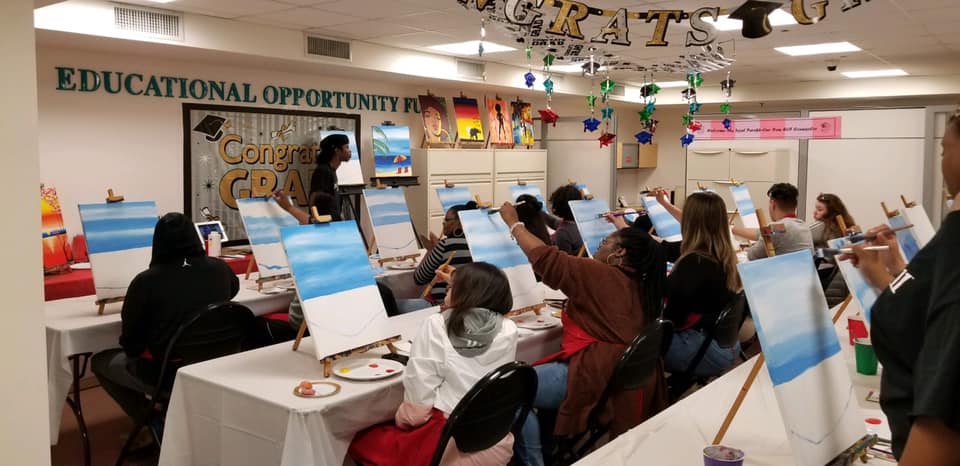 This is an image of students on the EOF space being instructed in a painting class