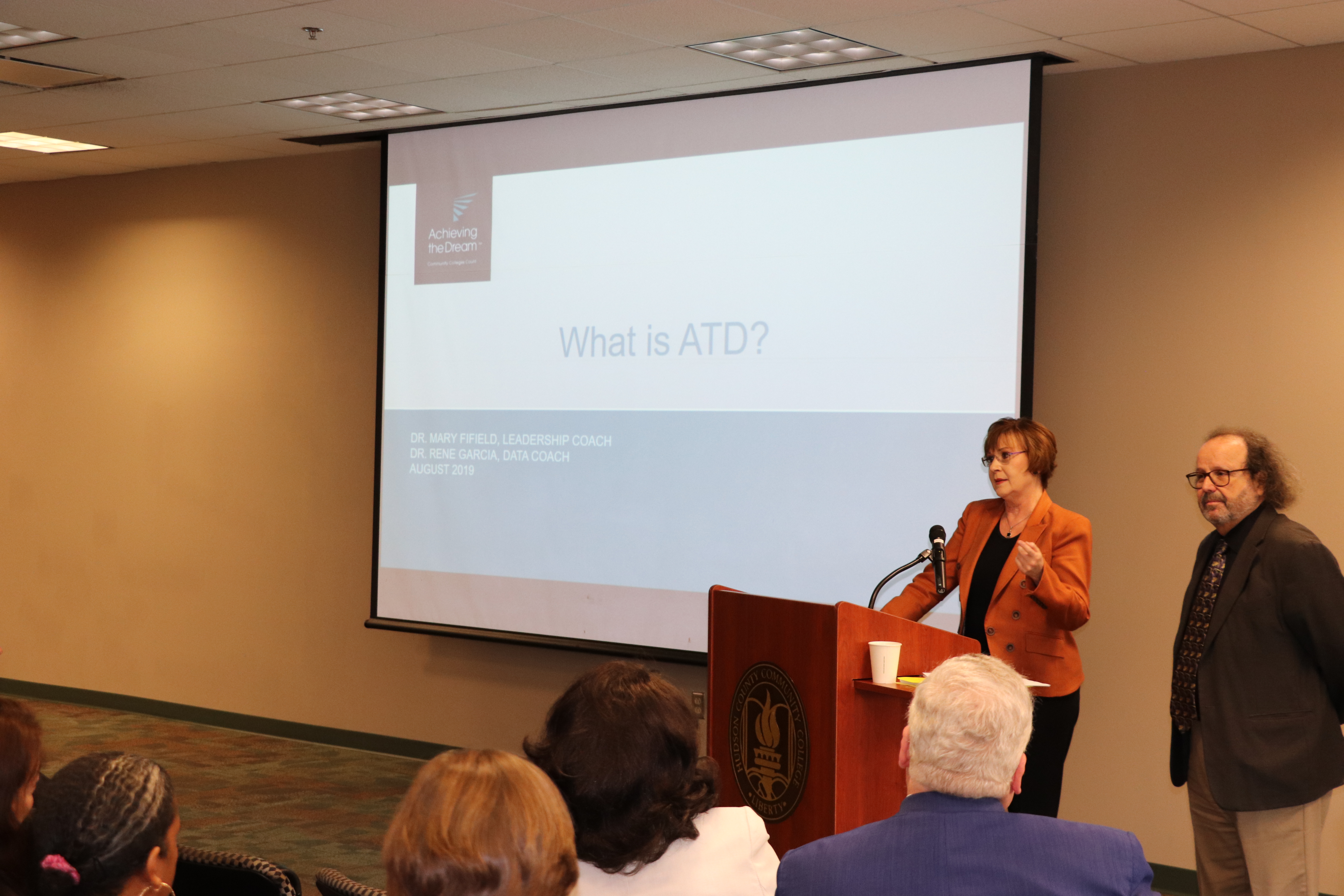 Dr. Fifield and Dr. Garcia present on the mission of ATD at College Service Day during their first site visit to HCCC