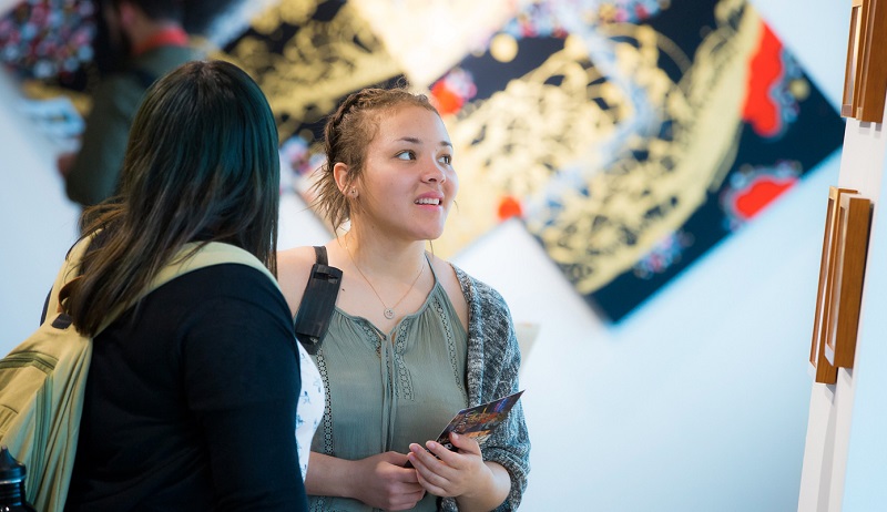 Students viewing work of HCCC Professor Eric Lee