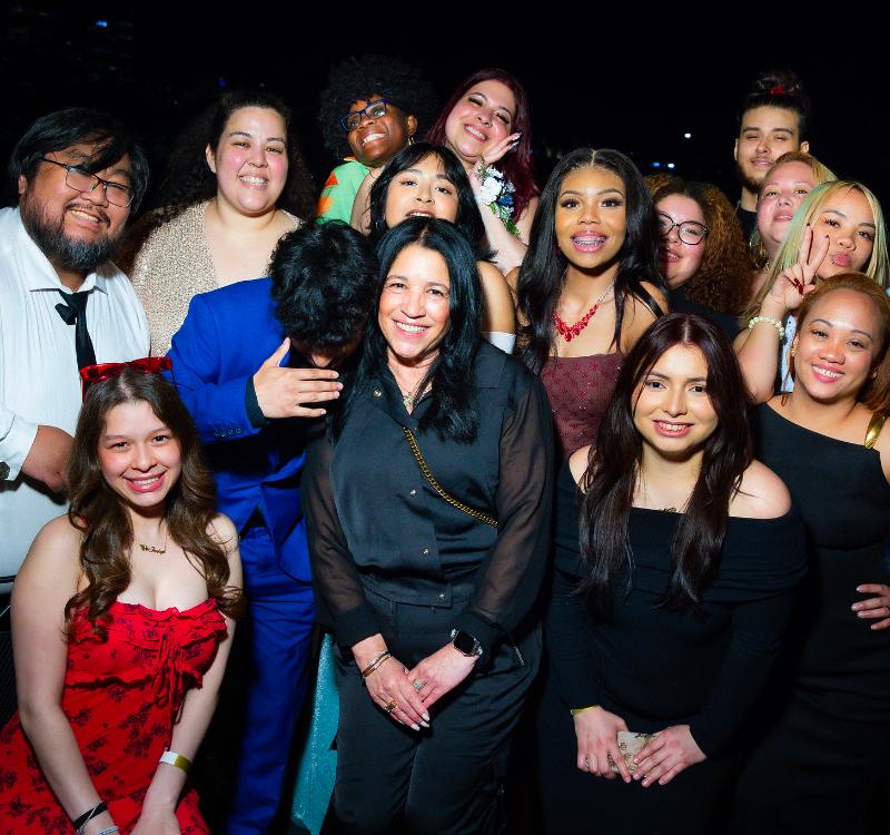 Students and supporters come together for a memorable group photo during an HCCC evening celebration, highlighting community, achievement, and campus engagement.