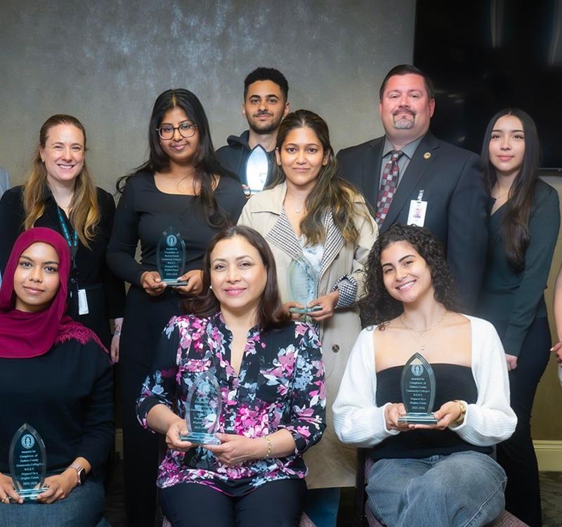 Student award recipients are recognized alongside faculty and staff during an HCCC ceremony celebrating academic achievement, leadership, and student success.