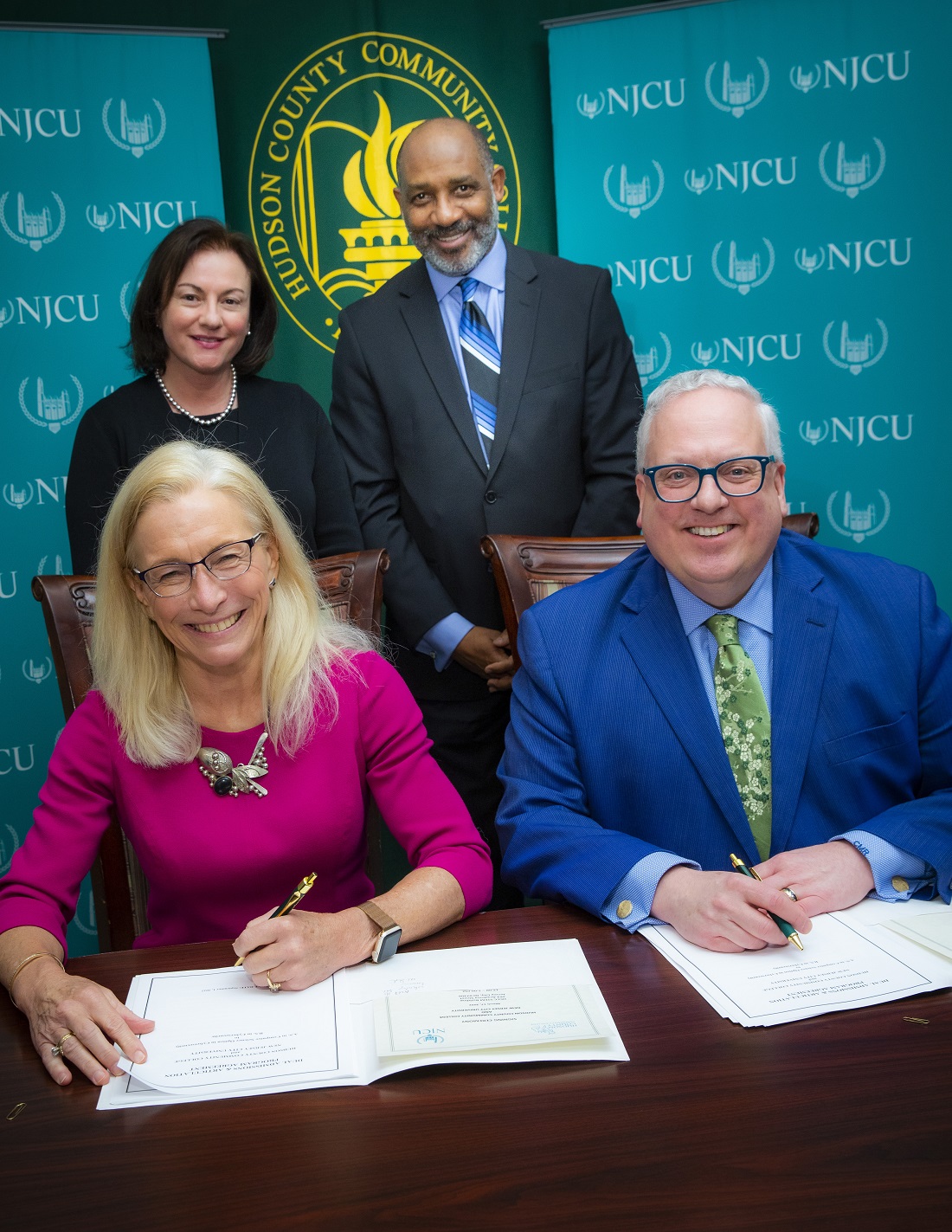 Seated: New Jersey City University President, Dr. Sue Henderson, and Hudson County Community College President, Dr. Chris Reber. Standing: Dr. Tamara Jhashi, NJCU Senior Vice President and Provost, and Dr. Darryl Jones, HCCC Vice President for Academic Affairs.