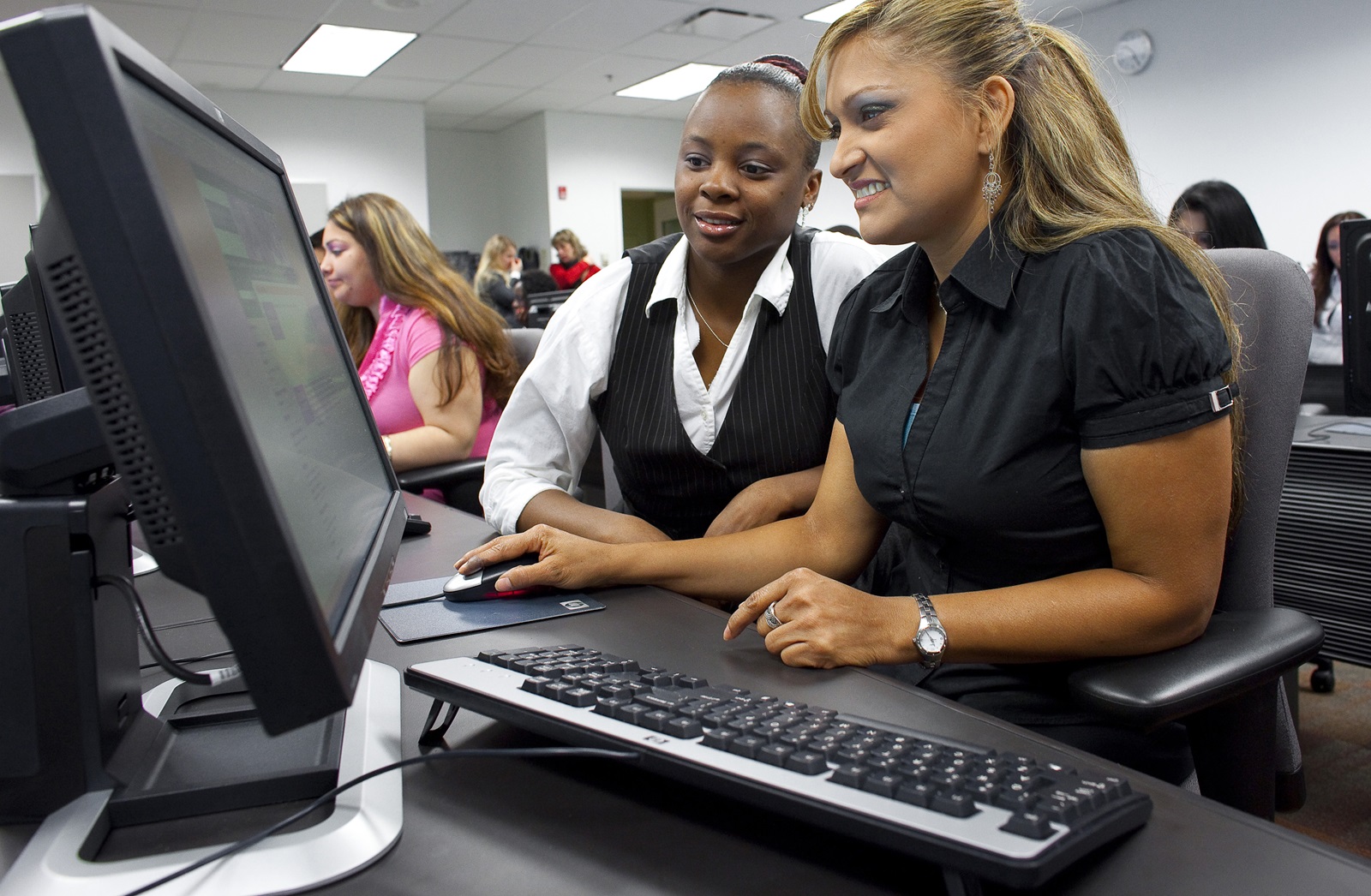 An HCCC student and mentor in one of the College’s STEM labs.