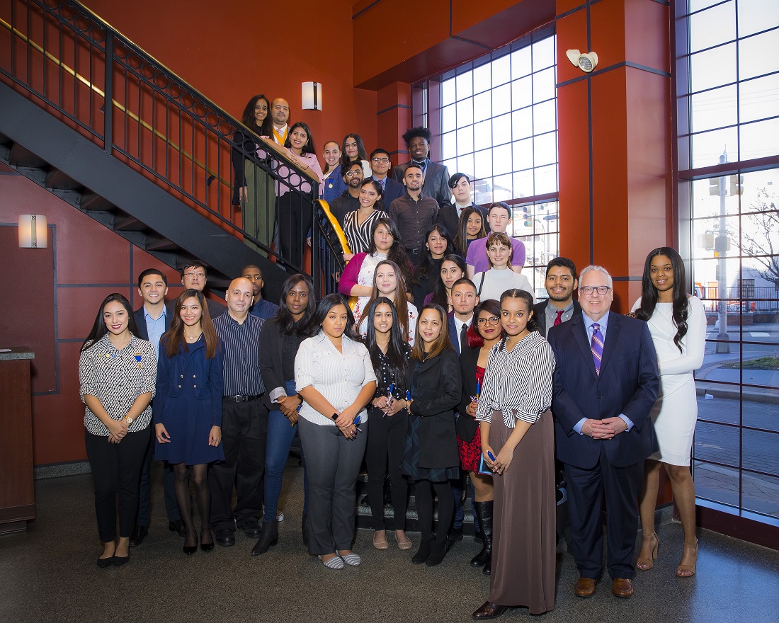 HCCC President Christopher Reber (second from right in foreground) with officers and members of HCCC’s chapter of Phi Theta Kappa Honor Society at a recent induction ceremony.