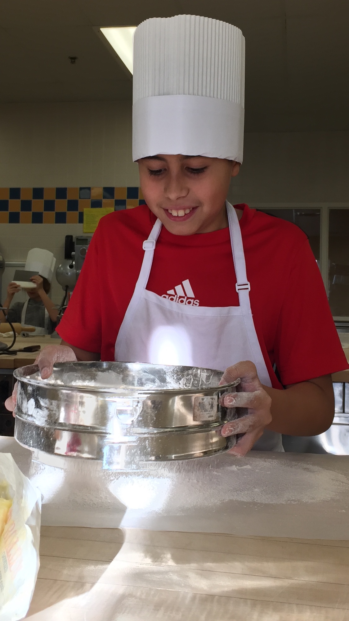 Kaivan Cuellar participates in a culinary cooking course for youths at Hudson County Community College.