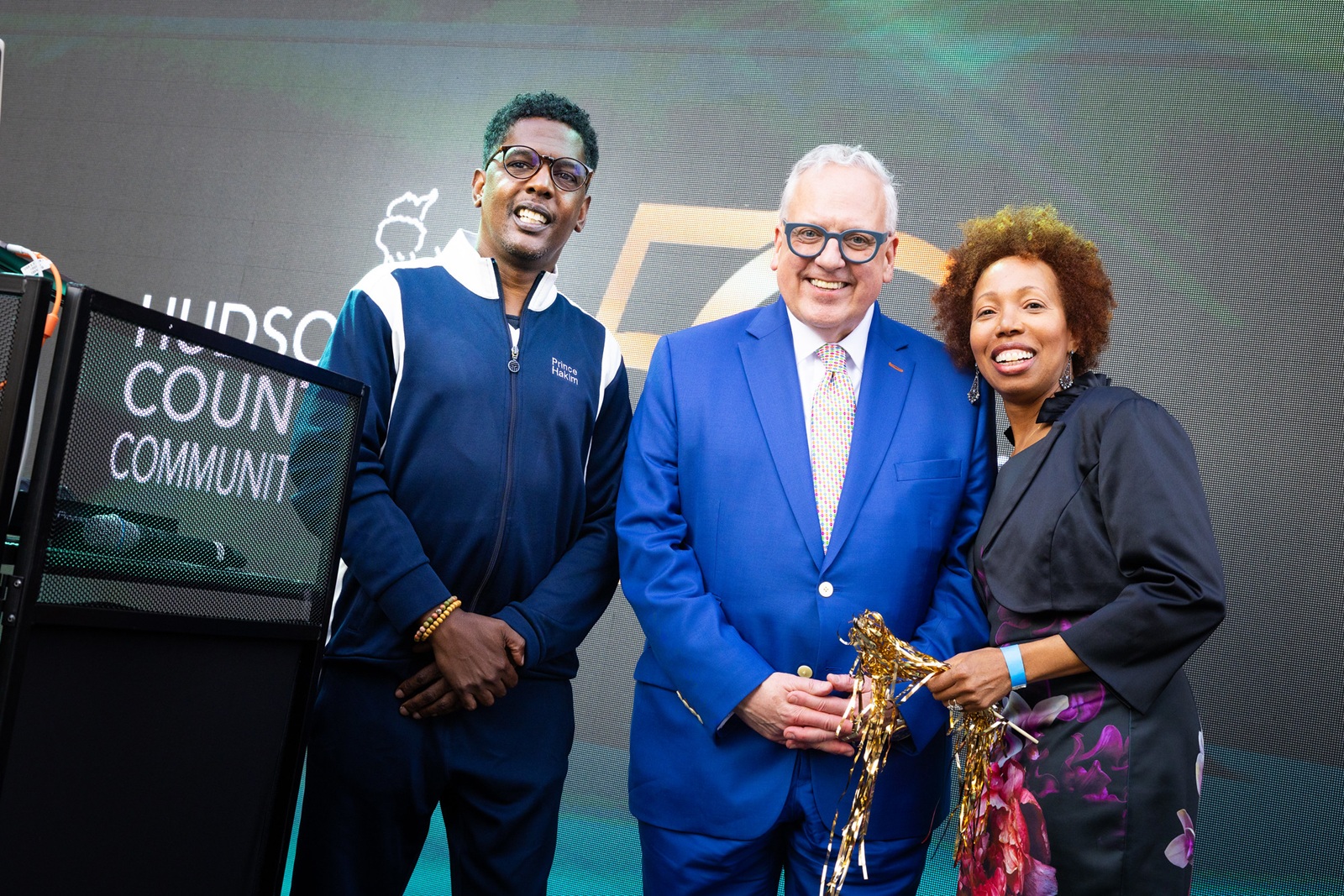 DJ Prince Hakim, HCCC President Dr. Christopher Reber, and HCCC Vice President for Advancement & Communications and Executive Director of the HCCC Foundation Nicole Johnson.