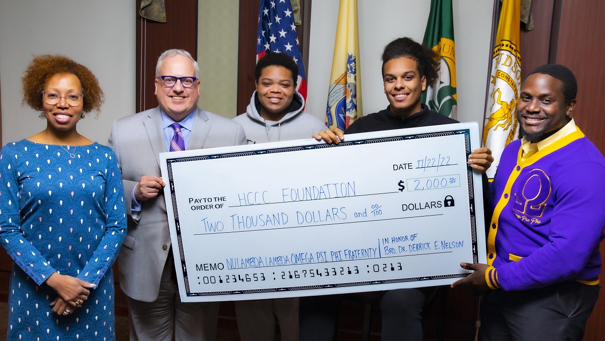 Pictured here, Hudson County Community College (HCCC) Vice President for Advancement and Communications, Nicole B. Johnson; HCCC President, Dr. Christopher Reber; HCCC students and recipients of Nu Lambda Lambda Chapter of Omega Psi Phi Fraternity, Inc. Scholarships, Michael Herron and Jaydean Wilkerson; and Nu Lambda Lambda Chapter Scholarship Committee Chair, Bro. Keith Cummings.